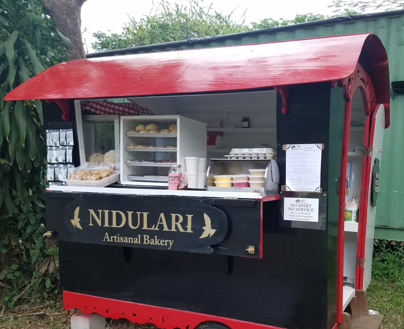 Nidulari serving counter and trailer shaded by trees at Little La Grange Village, St Croix